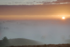 Sun rises over the fog